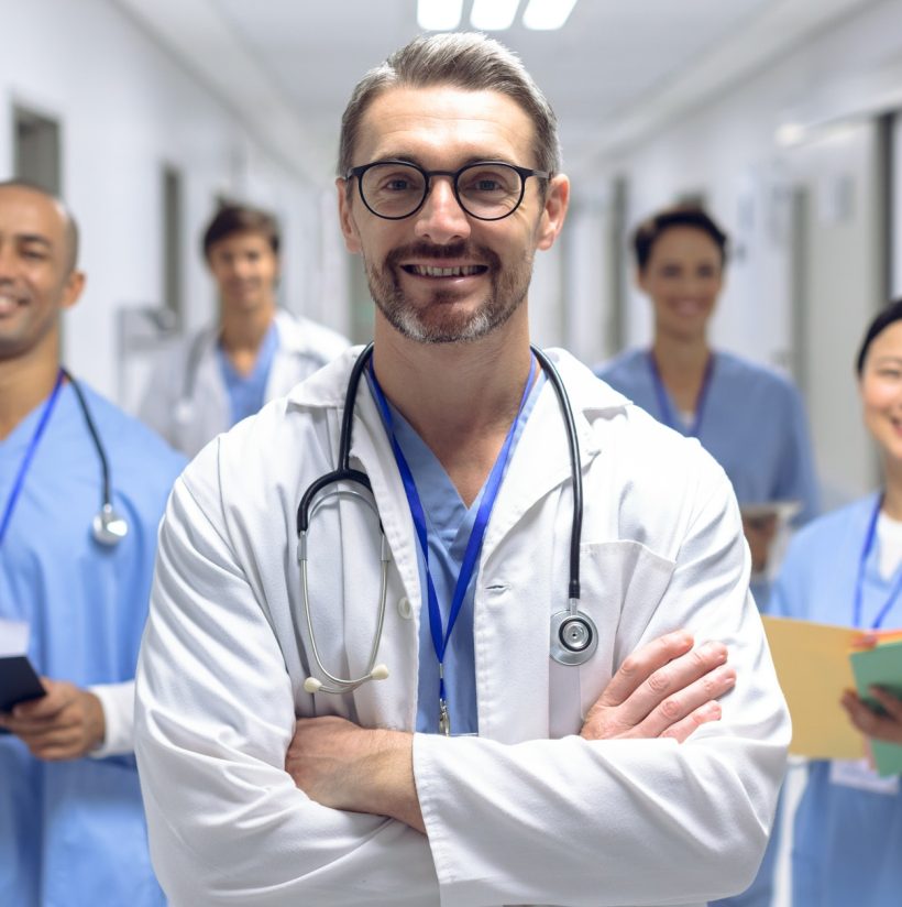 diverse-medical-team-of-doctors-looking-at-camera-while-holding-clipboard-and-medical-files.jpg